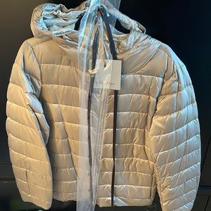 Reversible puffer jacket with belts